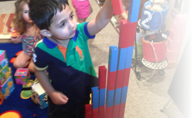 little kid playing blocks