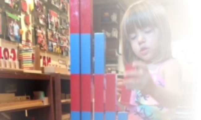 little girl playing with magnets