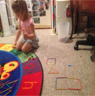 A girl playing toys