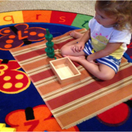 A girl playing tower toy